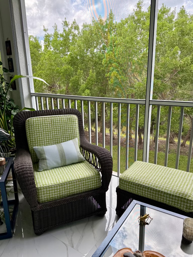Wicker lounge chair and ottoman with new green cushions